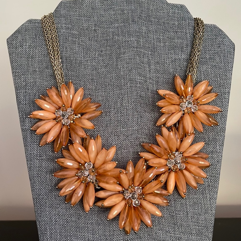 Statement necklace with five orange gold flowers